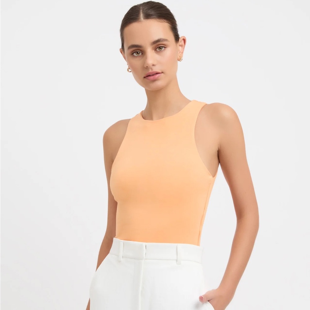 Kookai alpha crop tank in orange, buttery soft. Sold out online.